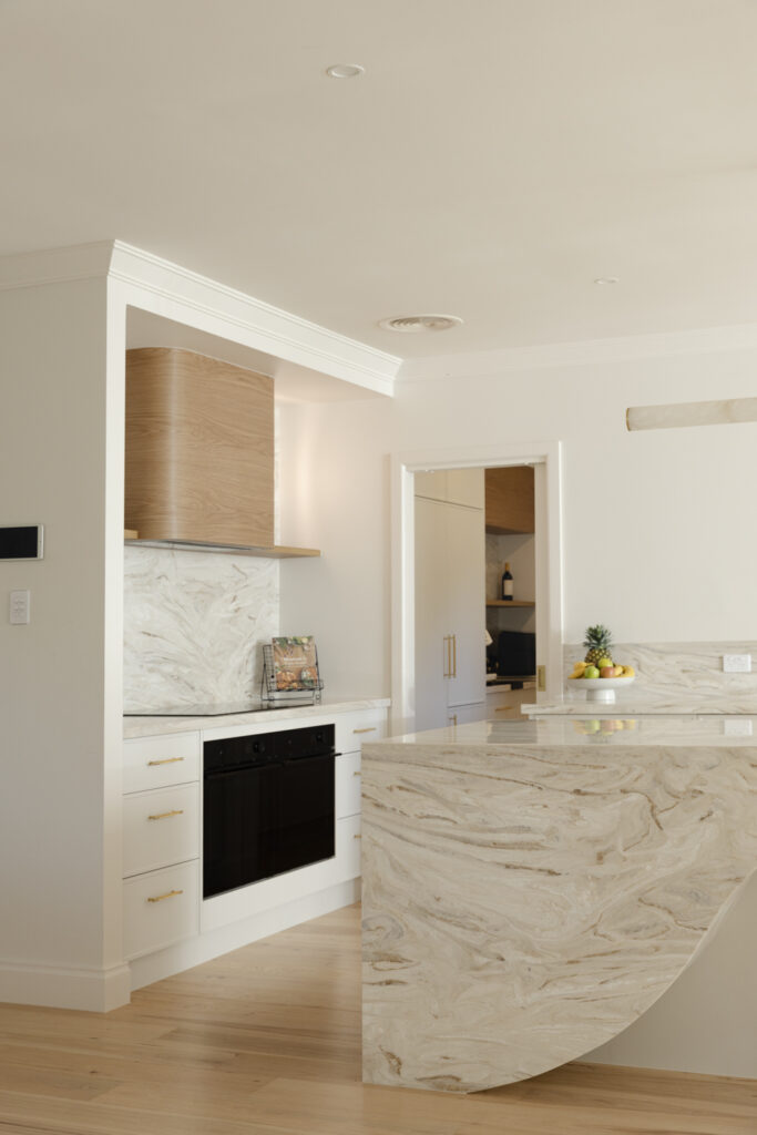 Modern kitchen with marble island and timber accents